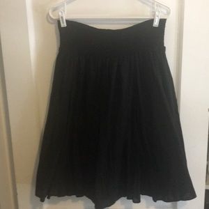 Very full, lined black skirt with elastic waist